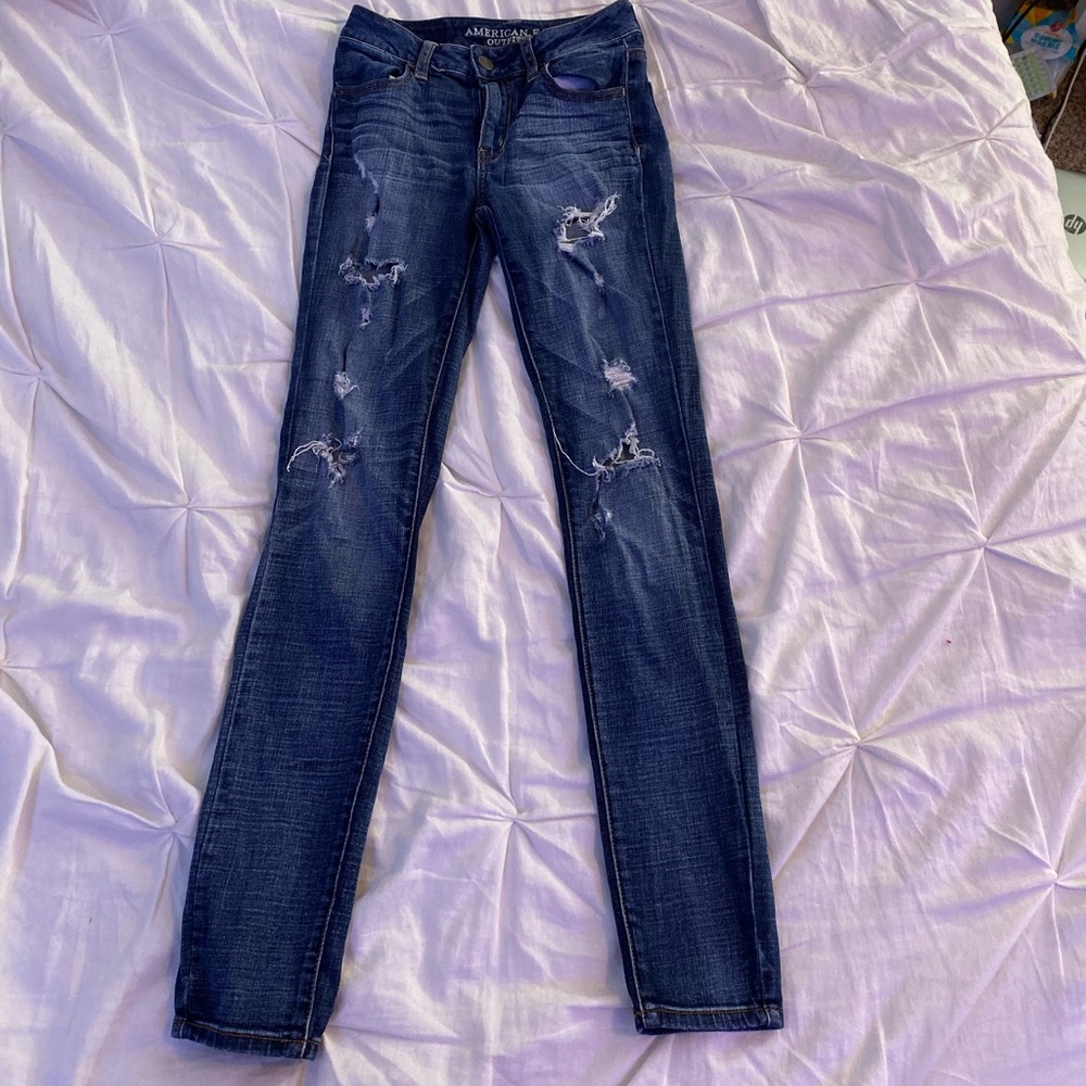 Ripped American Eagle jeans.
